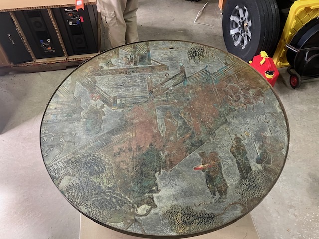 Round antique tabletop shown before packing review