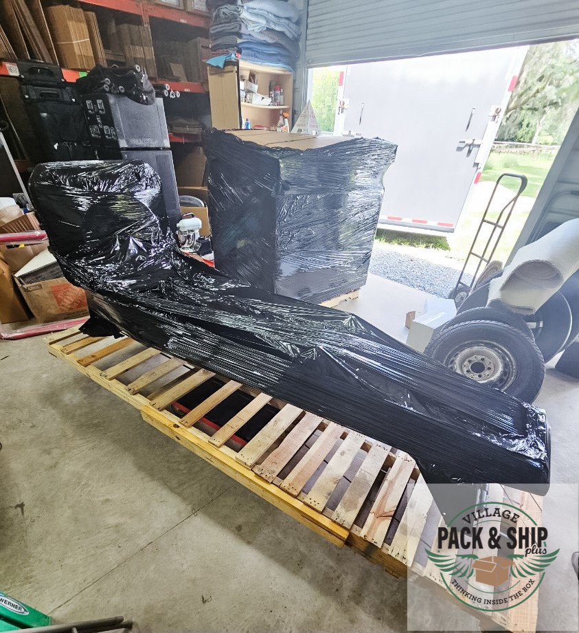 Large wrapped item strapped on a pallet